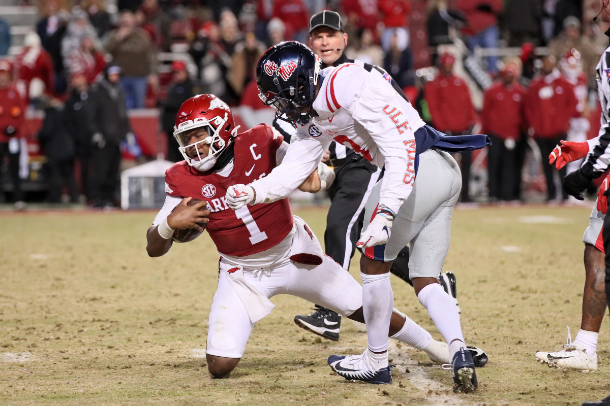 Ole Miss Rebels safety Otis Reese IV hits Arkansas Razorbacks quarterback KJ Jefferson in the backfield (2022). 